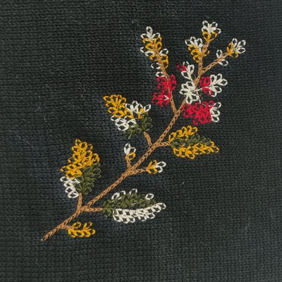 Floral embroidery on a knitted panel